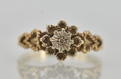 Lot 1254 - A 9ct yellow gold dress ring, with tiny...