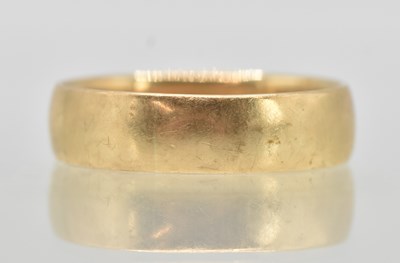 Lot 1219 - A large 9ct yellow gold wedding band, internal...