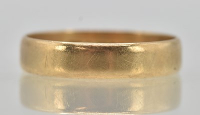Lot 1261 - A 9ct yellow gold large band ring, size X,...