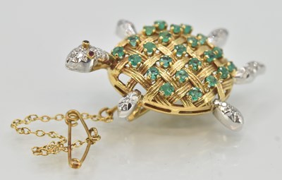 Lot 1424 - An 18ct yellow gold gem set brooch in the form...
