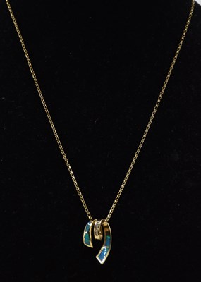 Lot 1441 - A modern 14K yellow gold coiled necklace, with...