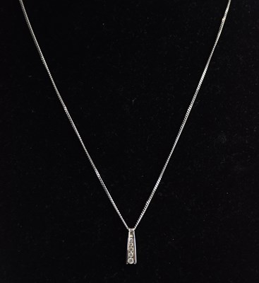 Lot 1371 - A 9ct yellow gold diamond set pendant, with...