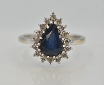 Lot 1332 - A white metal sapphire and diamond set ring,...
