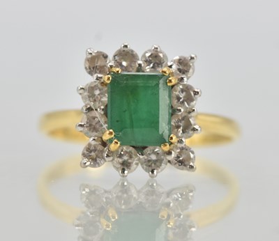 Lot 1194 - An 18ct yellow gold emerald and diamond set...