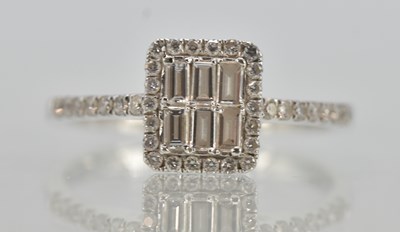 Lot 1195 - An 18ct white gold diamond set cluster ring,...