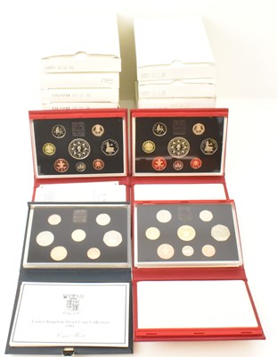 Lot 1560 - Eighteen UK proof coin sets comprising two...