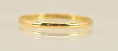 Lot 1233 - A 22ct yellow gold band ring, size U, approx 1....