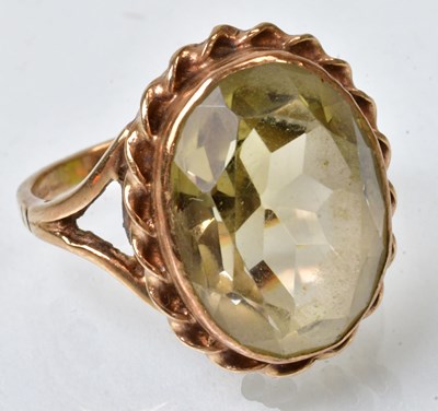 Lot 780 - A 9ct yellow gold cocktail ring set with a...