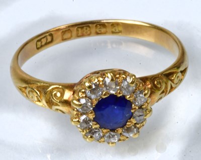 Lot 765 - An 18ct yellow gold cluster ring set with a...