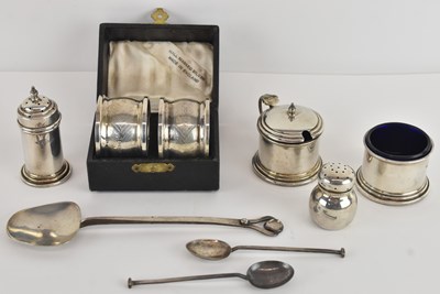 Lot 1043 - A George V hallmarked silver three piece cruet...