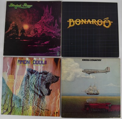 Lot 297 - Four albums comprising Bonaroo self-titled,...