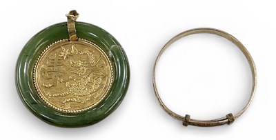 Lot 1518 - A Chinese pierced circular yellow metal...