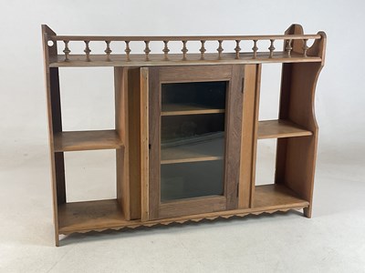 Lot 653 - A pine wall cabinet with central glazed door...