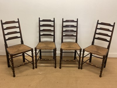 Lot 666 - Four 19th century oak ladder back chairs with...