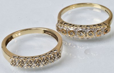 Lot 783 - A 9ct yellow gold ring set with seven tiny...