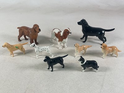 Lot 287 - BESWICK; nine ceramic models of dogs,...