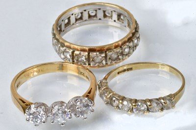 Lot 785 - A 9ct yellow and white gold eternity ring set...