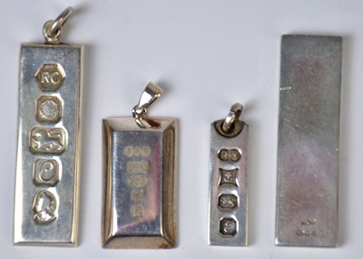 Lot 827 - Three hallmarked silver ingot pendants,...
