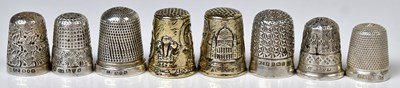 Lot 521 - A cased pair of hallmarked silver thimbles...