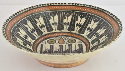 Lot 495 - A Persian Nishapur pottery bowl, with hand...
