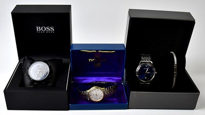 Lot 903 - Three boxed gentlemen's stainless steel...