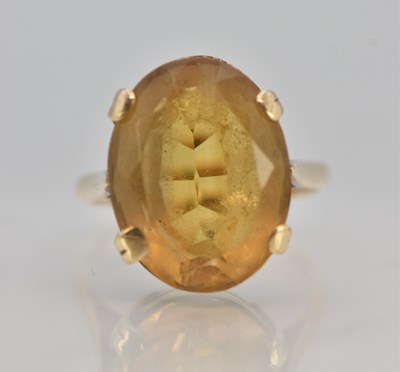 Lot 1226 - A 9ct yellow gold citrine set dress ring, the...