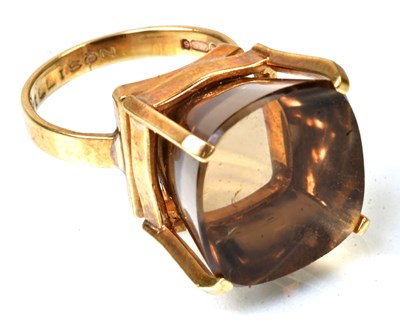 Lot 779 - A 9ct yellow gold cocktail ring set with a...