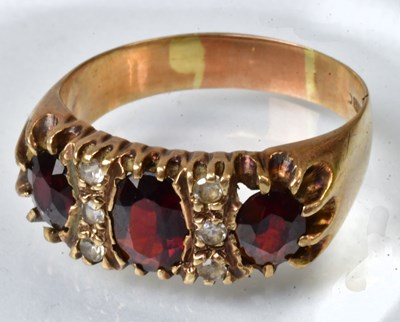 Lot 784 - A 9ct yellow gold ring set with three oval...