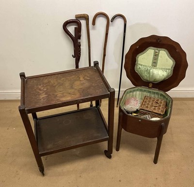 Lot 680 - A mahogany sewing table with contents, and a...