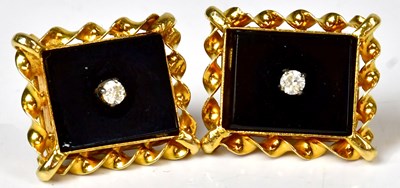 Lot 840 - A pair of yellow metal stud earrings, each set...