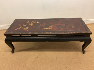Lot 681 - A Chinese lacquered coffee table, with a flora...