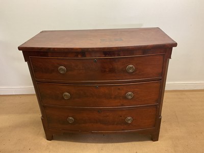Lot 638 - A Georgian mahogany bowfronted chest of three...