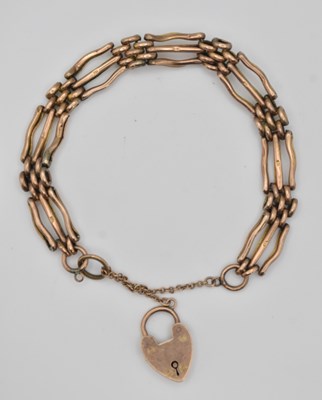 Lot 1454 - A 9ct yellow gold gate link bracelet, with...