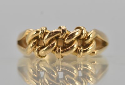Lot 1217 - An 18ct yellow gold knot ring, size J, approx...
