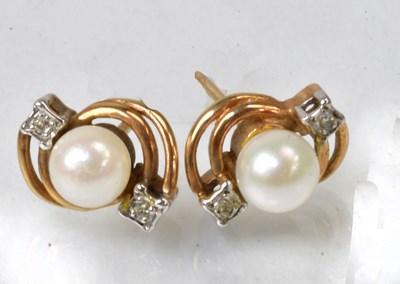 Lot 837 - A pair of 9ct yellow gold stud earrings, each...