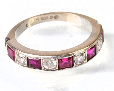 Lot 770 - An 18ct white gold half eternity ring, set...