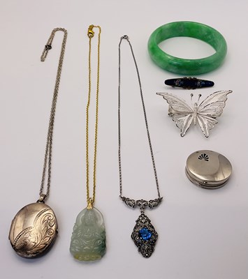 Lot 502 - A silver oval locket on chain, a silver...