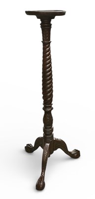 Lot 47 - An early 20th century carved mahogany tripod...