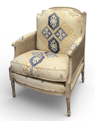 Lot 70 - A modern white painted bergère cream...