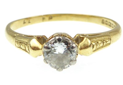 Lot 935 - An 18ct gold diamond solitaire ring, the claw...