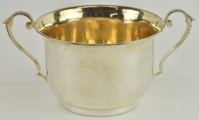 Lot 1046 - An Edward VII hallmarked silver twin handled...