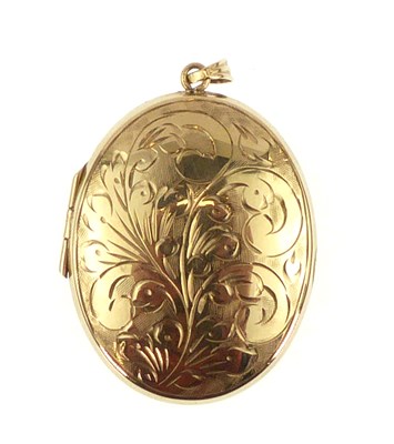 Lot 1030 - A 9ct gold oval double locket with a floral...