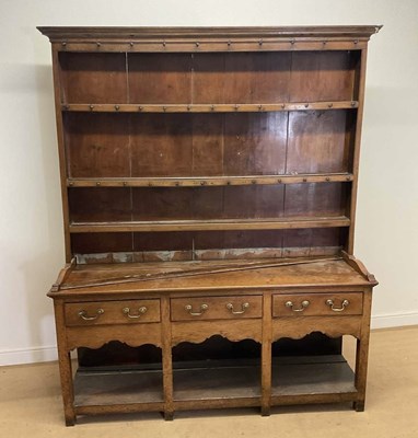 Lot 634 - A large oak Welsh style dresser, with a three...