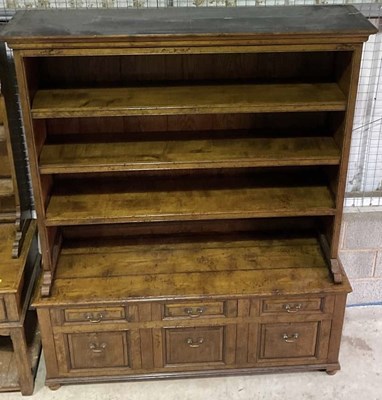 Lot 635 - A large oak bookcase, with three shelves to...