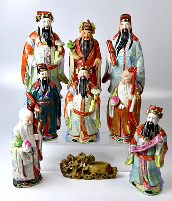 Lot 205 - Eight Chinese ceramic figures of sages in...