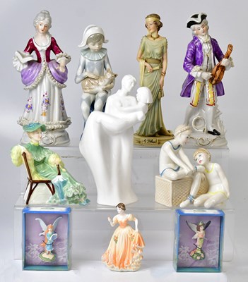 Lot 139 - A collection of porcelain figures, including...