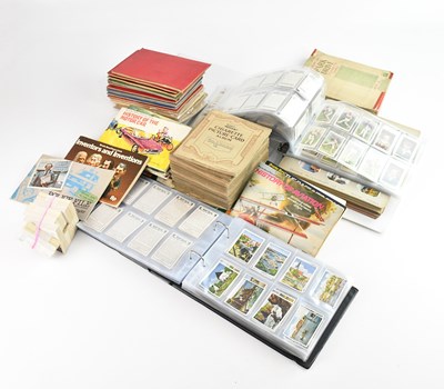 Lot 1668 - A collection of cigarette cards in albums and...
