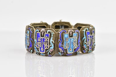 Lot 137 - A Chinese white metal and enamel bracelet set...