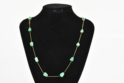 Lot 403 - A yellow metal and turquoise set necklace, set...