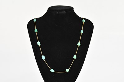 Lot 404 - A yellow metal and turquoise set necklace,...